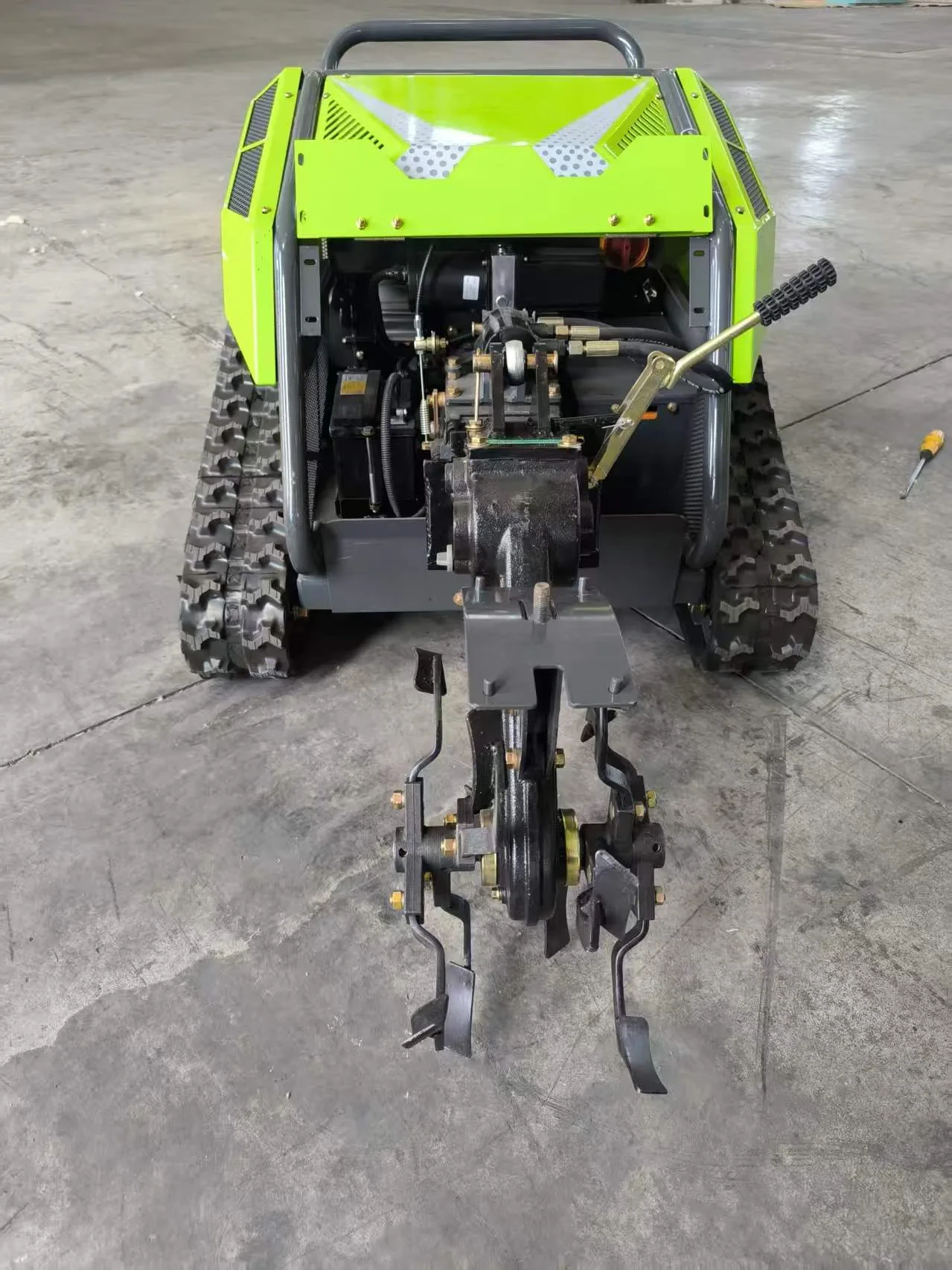Tracked mower attachment interface and exposed mechanical linkage